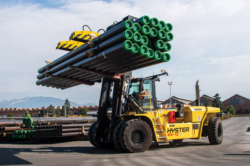 image of forklift truck carrying pipes